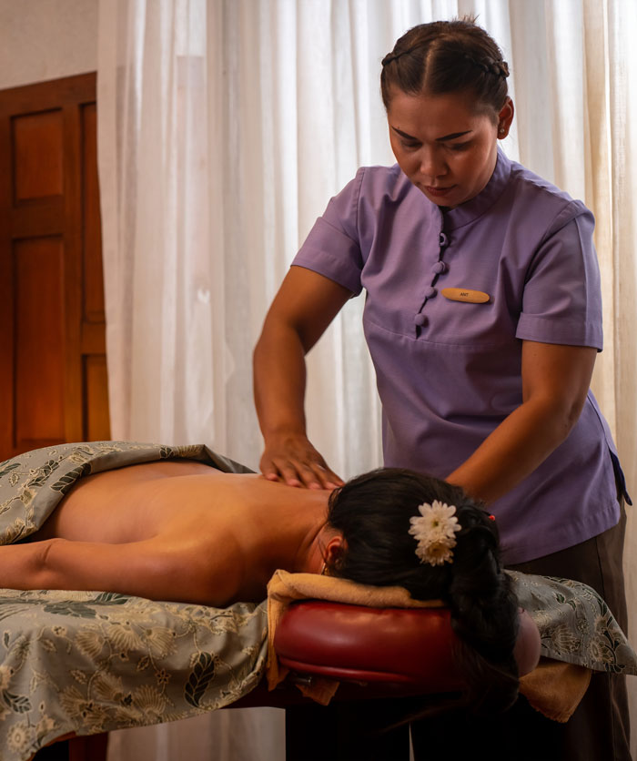 Young woman having massage at Dewa Phuket Resort Lime Leaf Spa