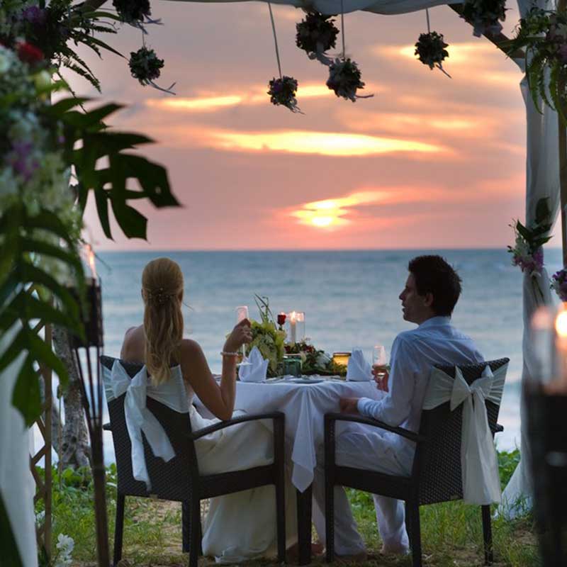 Honeymoon couple having dinner at the beach at Dewa Resort Phuket