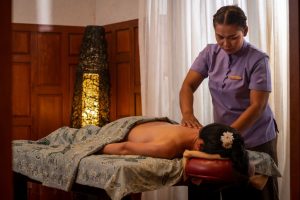 Asian girl is having a massage at Phuket Resort Spa Lime Leaf